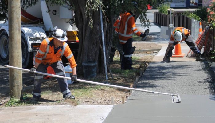 Workers-laying-concrete-path
